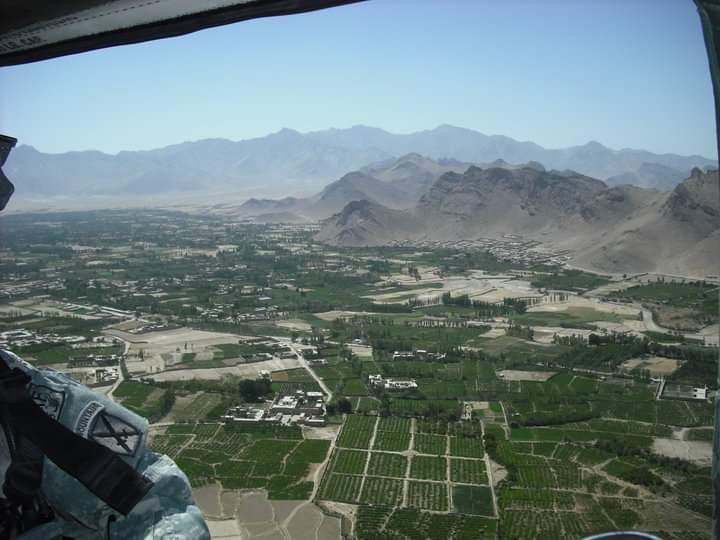 Aerial view from a service aircraft over mountains and fields